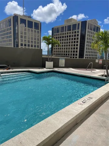 a front view of a building with garden