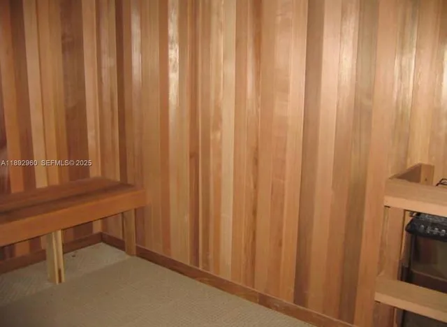 a view of a balcony with two chairs