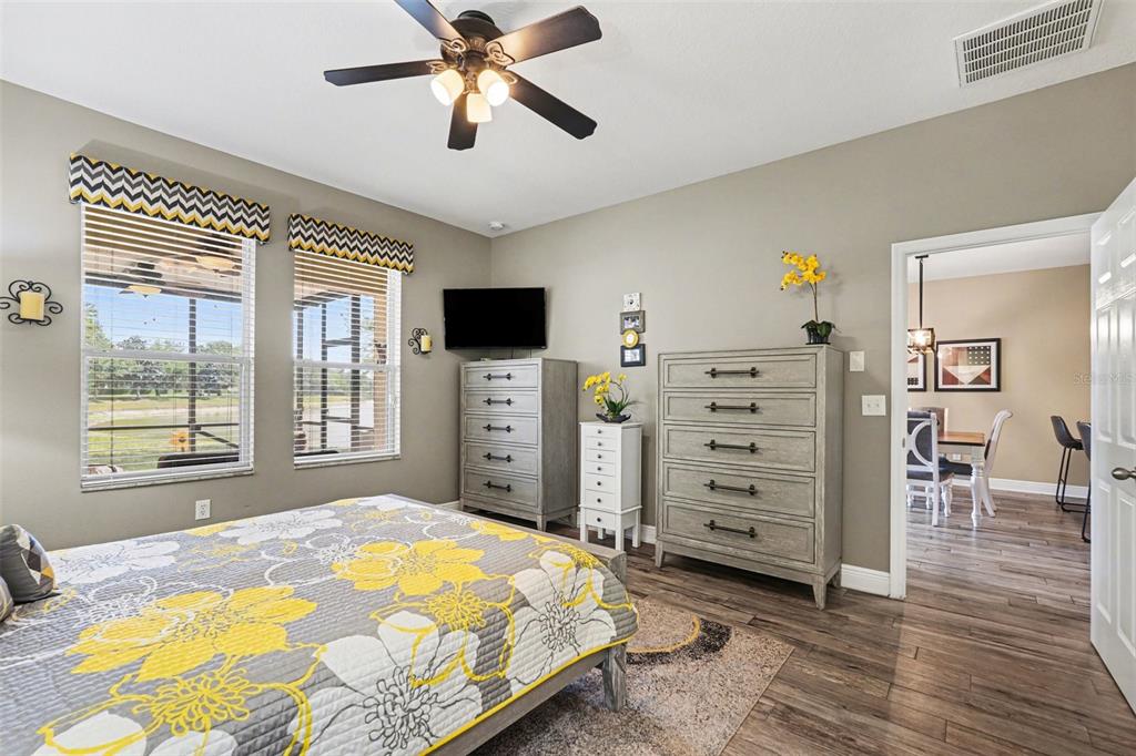 2134 Barracuda Court Holiday, FL 34691 - Photo 20 of 36 a bedroom with a bed and wooden floor