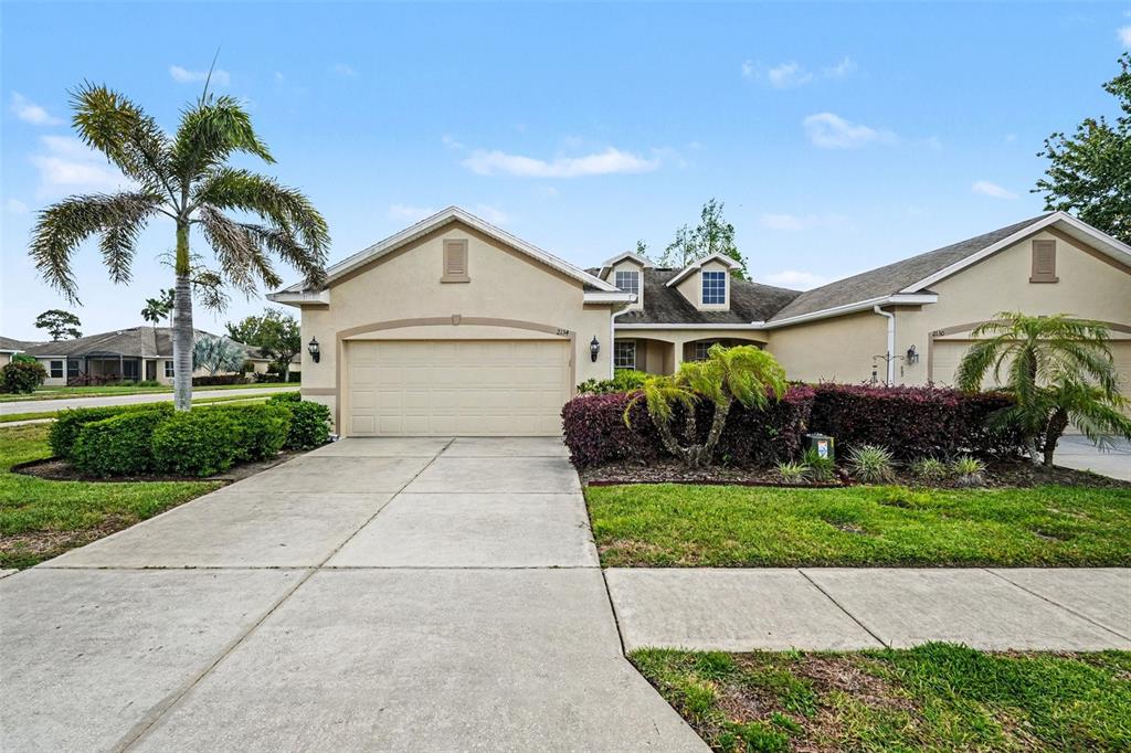 2134 Barracuda Court Holiday, FL 34691 - Photo 2 of 36 a front view of a house with a garden