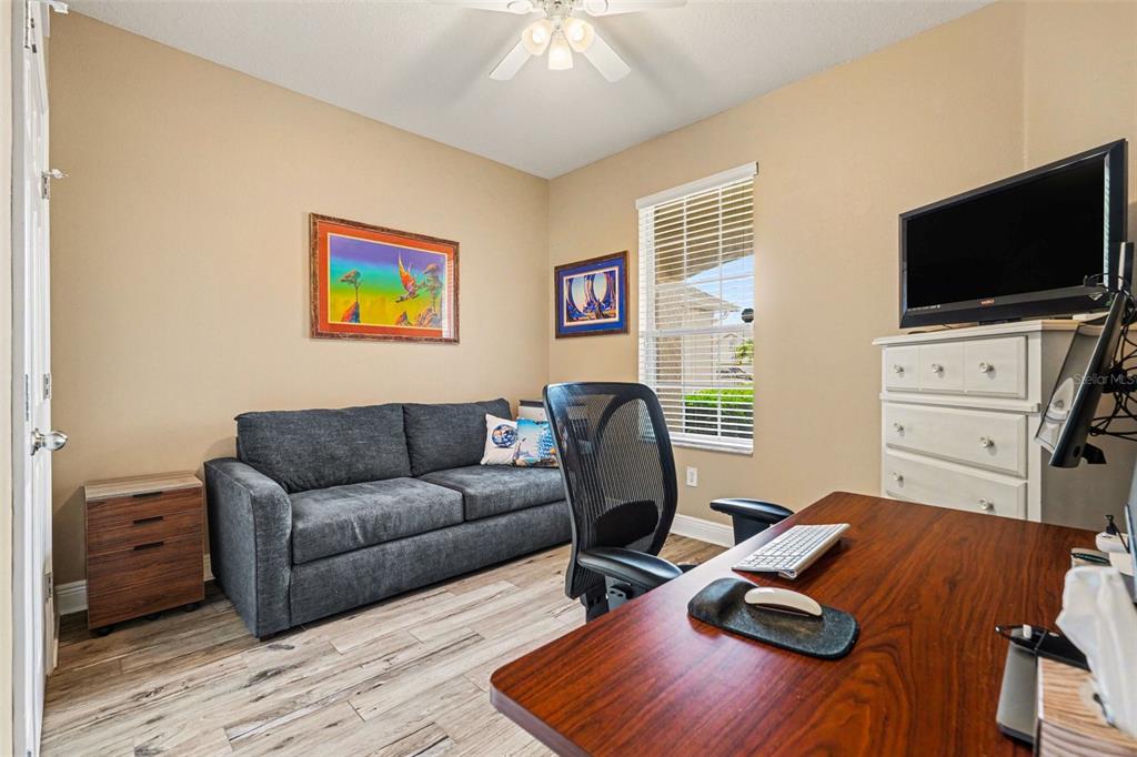2134 Barracuda Court Holiday, FL 34691 - Photo 23 of 36 a living room with furniture and a flat screen tv