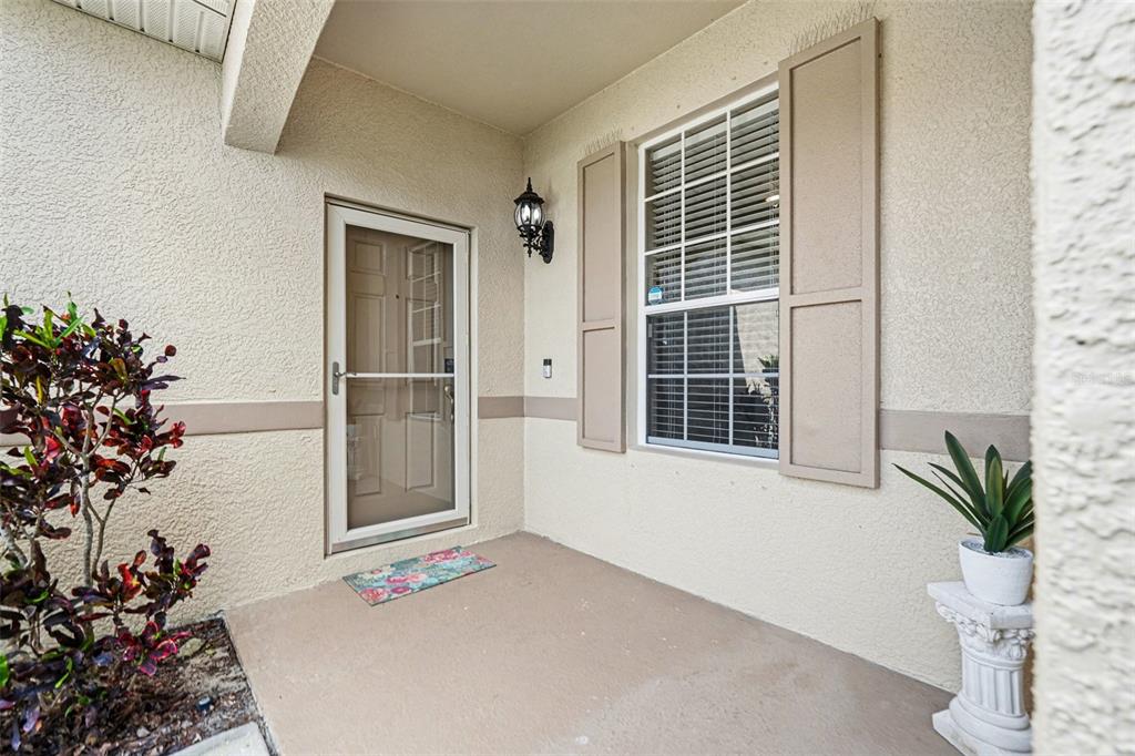 2134 Barracuda Court Holiday, FL 34691 - Photo 28 of 36 a front view of a house with a potted plant