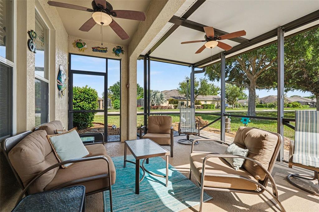 2134 Barracuda Court Holiday, FL 34691 - Photo 30 of 36 a living room with furniture and a floor to ceiling window