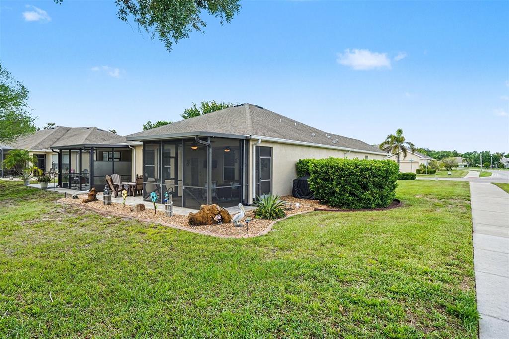 2134 Barracuda Court Holiday, FL 34691 - Photo 32 of 36 a front view of a house with a yard table and chairs