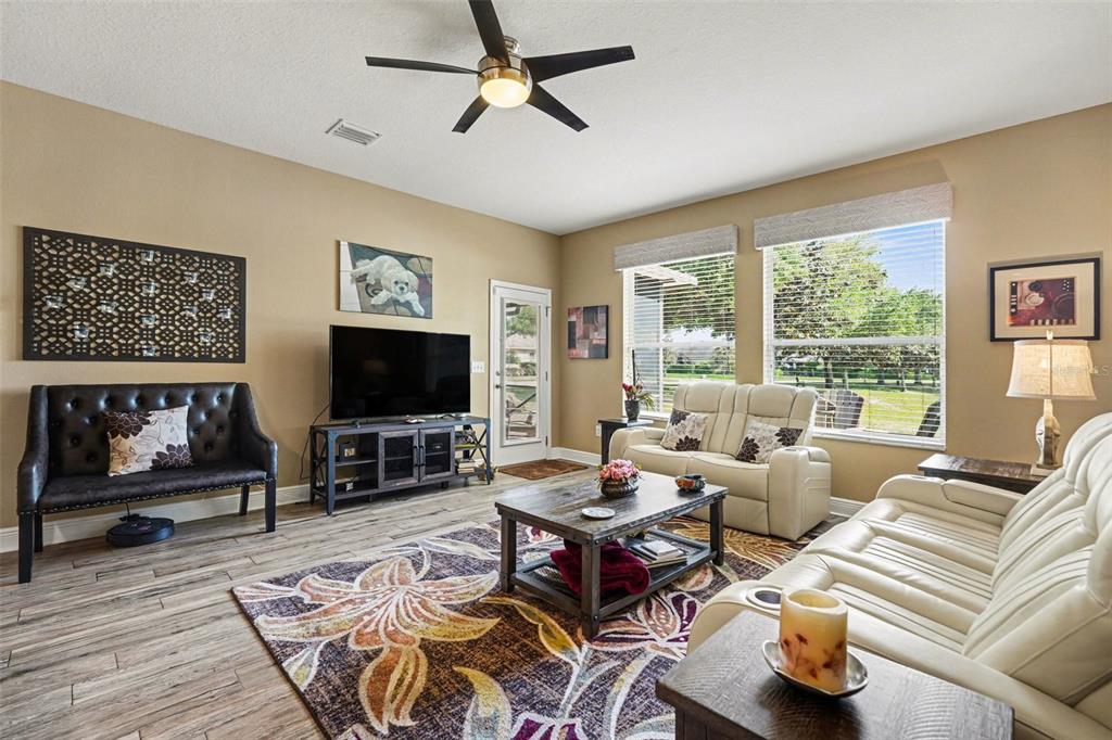 2134 Barracuda Court Holiday, FL 34691 - Photo 6 of 36 a living room with furniture and a flat screen tv