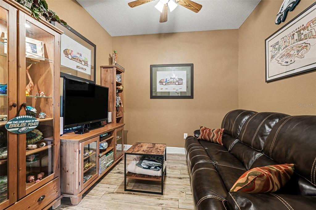 2134 Barracuda Court Holiday, FL 34691 - Photo 8 of 36 a living room with furniture and a flat screen tv