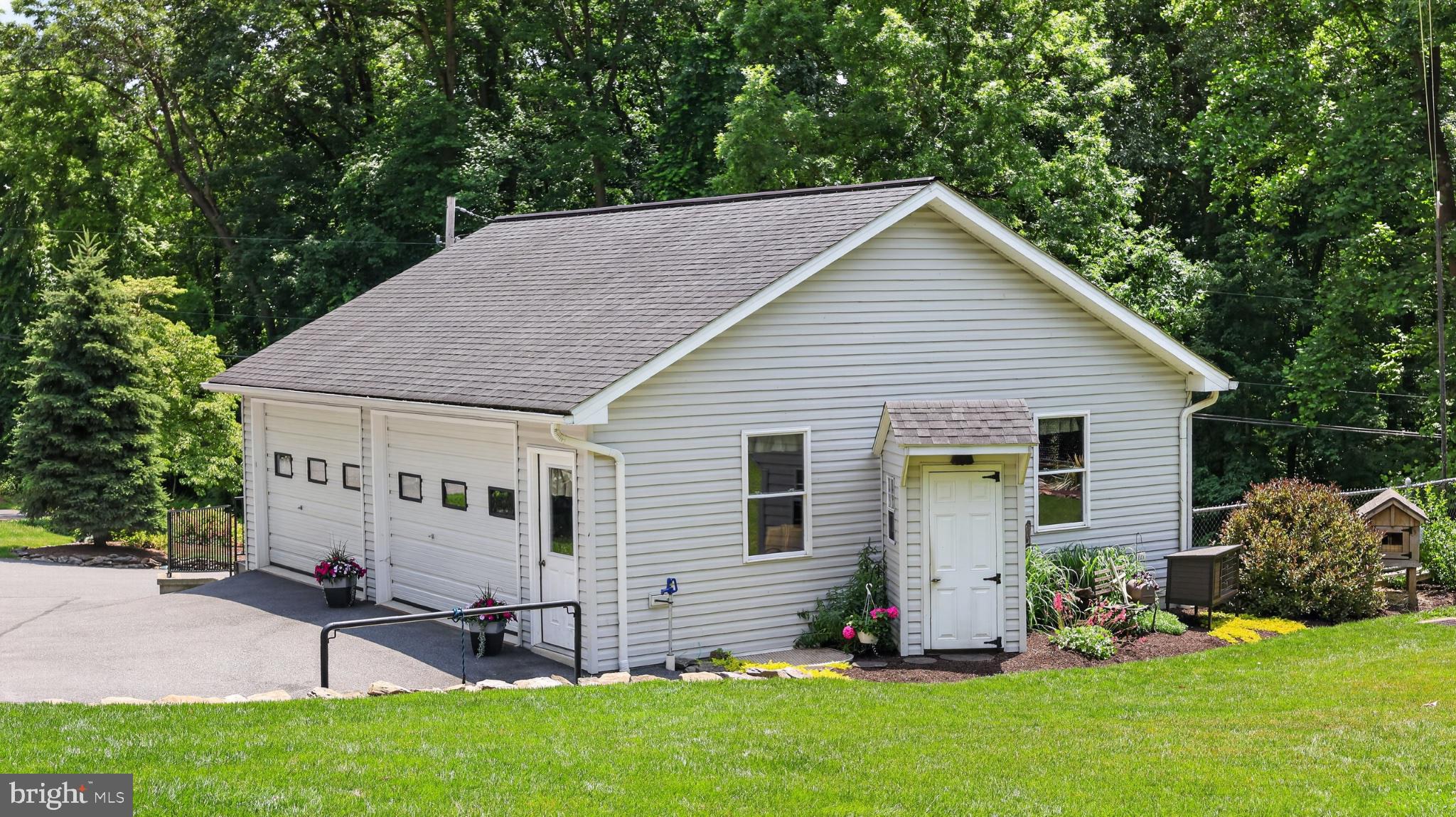 257 Hill Road New Holland, PA 17557 - Photo 50 of 94 Charming garage nestled in nature.