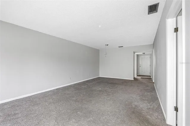 a view of a workspace with furniture and wooden floor