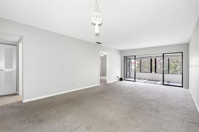 a view of an empty room with a window