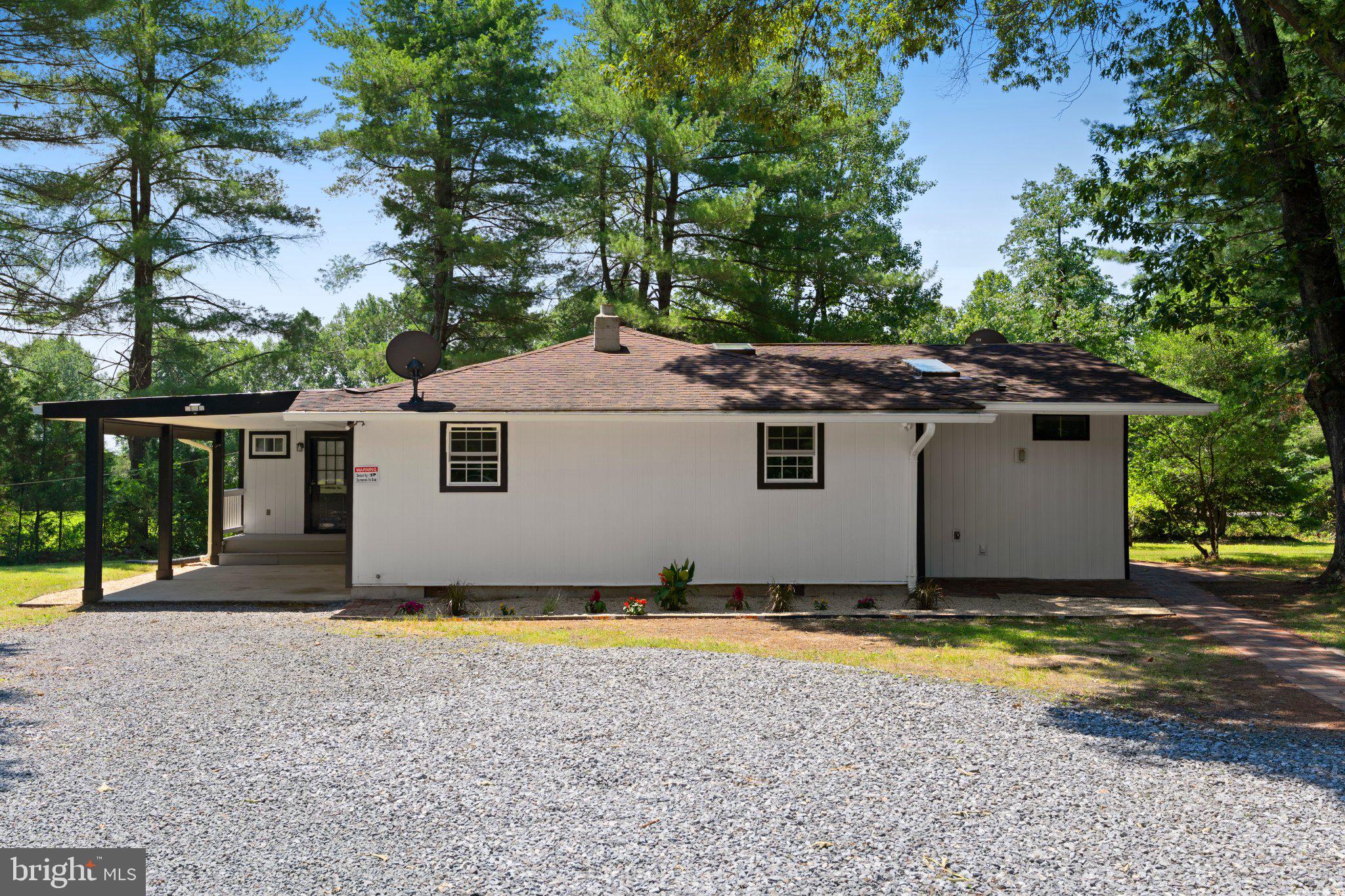 8405 Shirley Road Spotsylvania, VA 22551 - Photo 3 of 42 a view of a house with backyard and sitting area