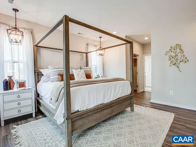 a bed room with a bed and a window