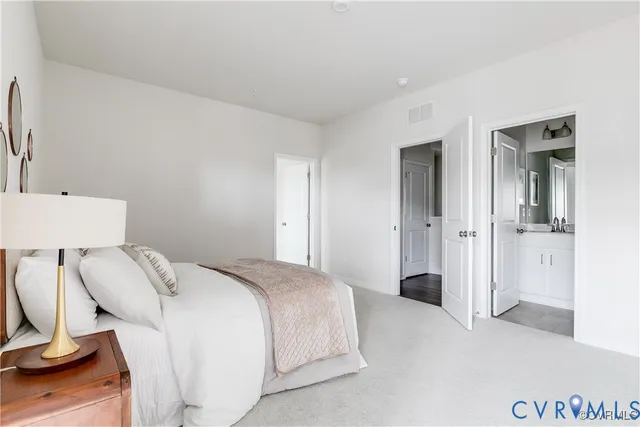 a bedroom with a bed and a desk