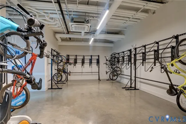 a living room with lots of furniture and a chandelier