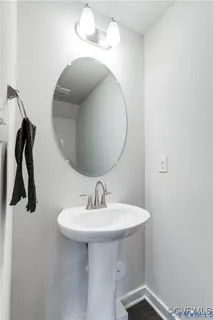 a bathroom with a sink and mirror