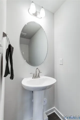 a bathroom with a sink and mirror