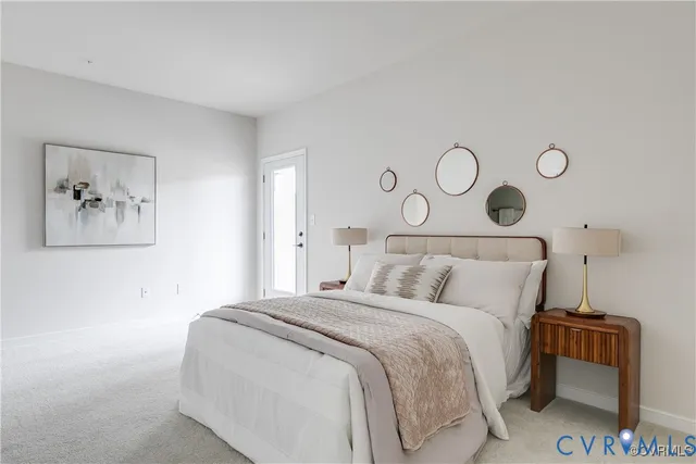 a bedroom with a bed and cabinets