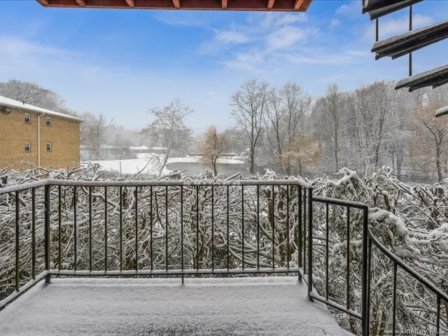 a view of street from balcony