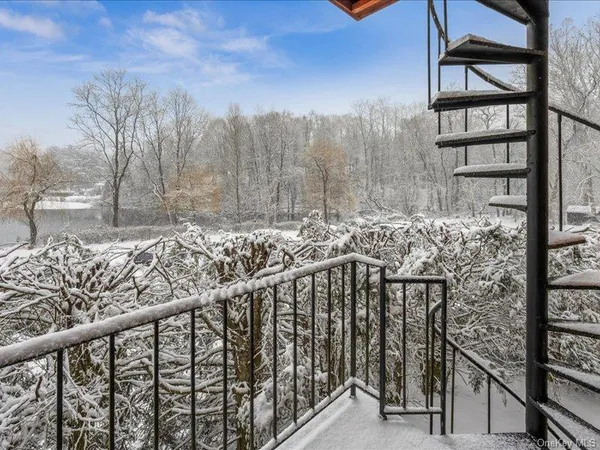 a view of a balcony with an outdoor space