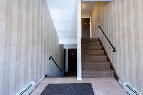 a view of empty room with a fireplace