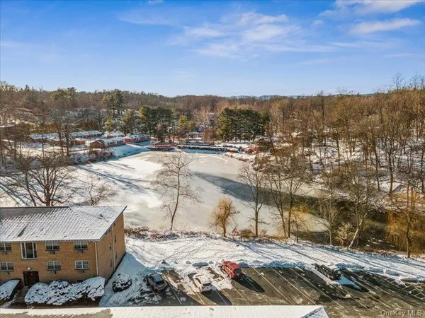 an aerial view of residential building with parking space