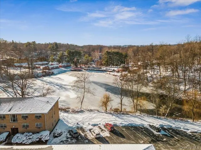 an aerial view of residential building with parking space