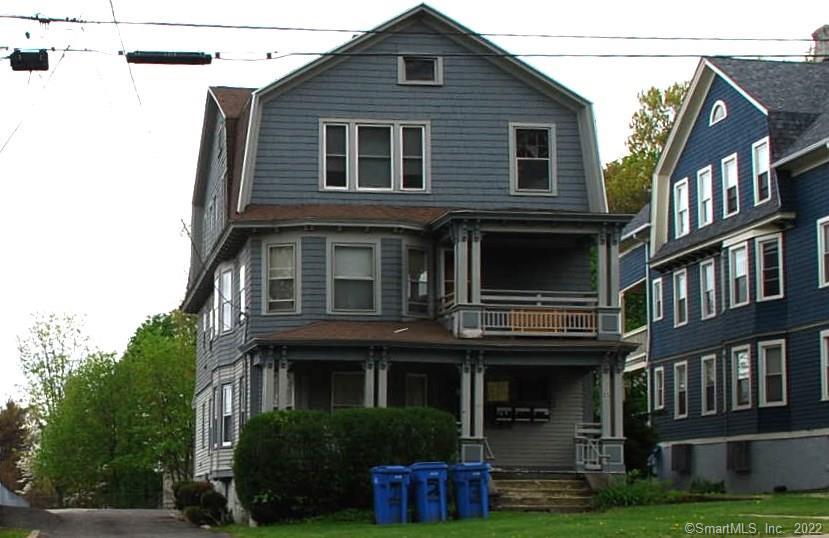 25 Robbins Street Waterbury, CT 06708 - Photo 1 of 1 a front view of a house with garden