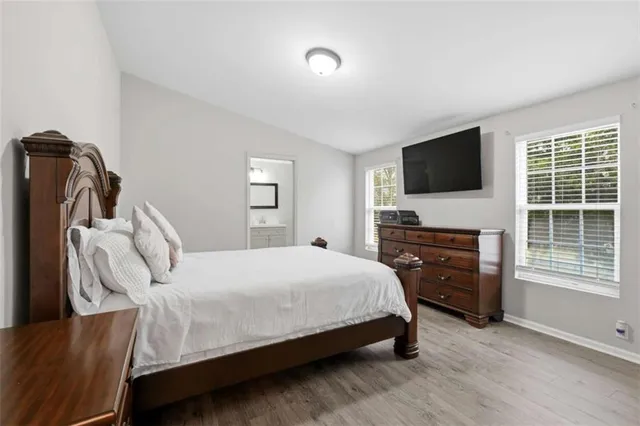 a bedroom with a bed and a dresser