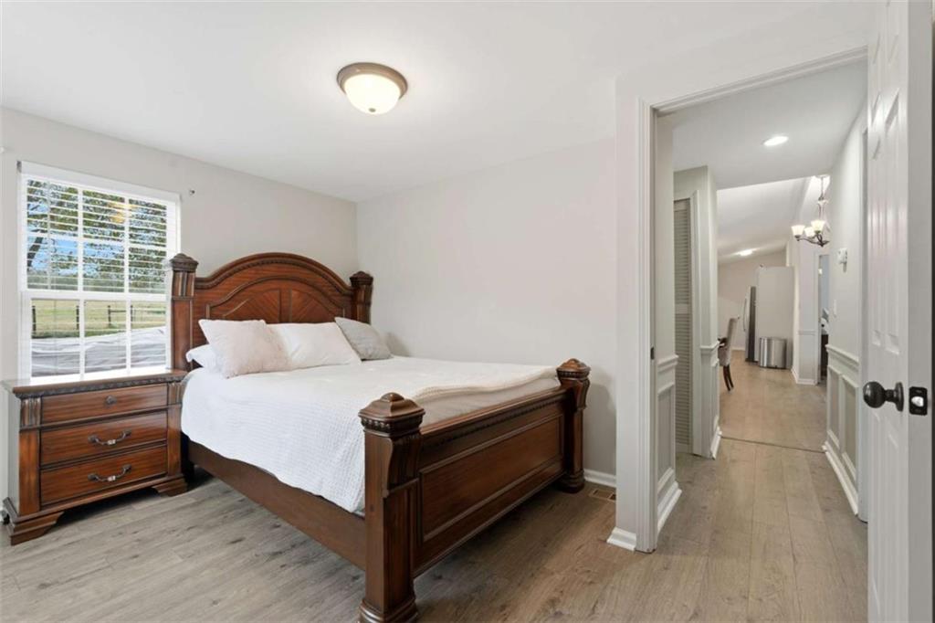 1295 Double Bridges Road Winder, GA 30680 - Photo 25 of 59 a bedroom with a bed and a window