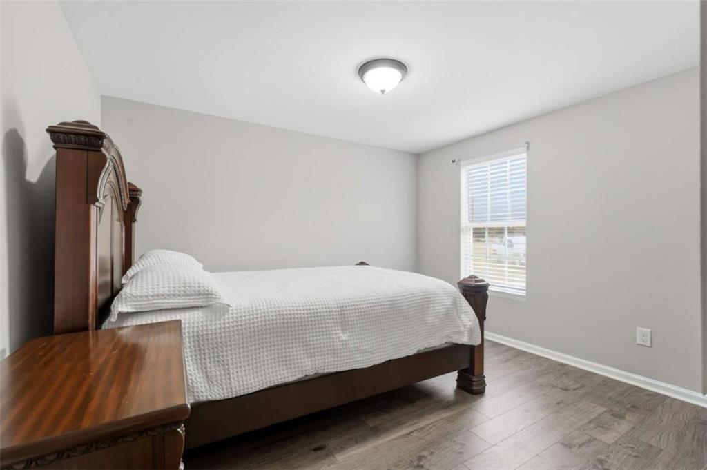 1295 Double Bridges Road Winder, GA 30680 - Photo 27 of 59 a bedroom with a bed and a window