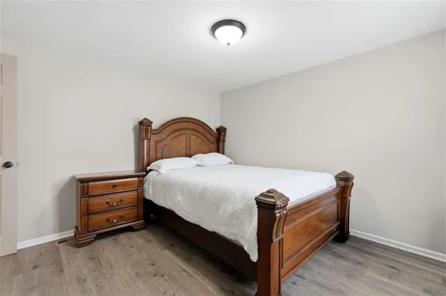 an aerial view of residential houses with outdoor space and swimming pool
