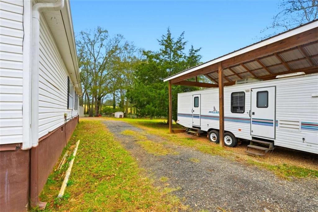 1295 Double Bridges Road Winder, GA 30680 - Photo 34 of 59 a view of a house with backyard and sitting area