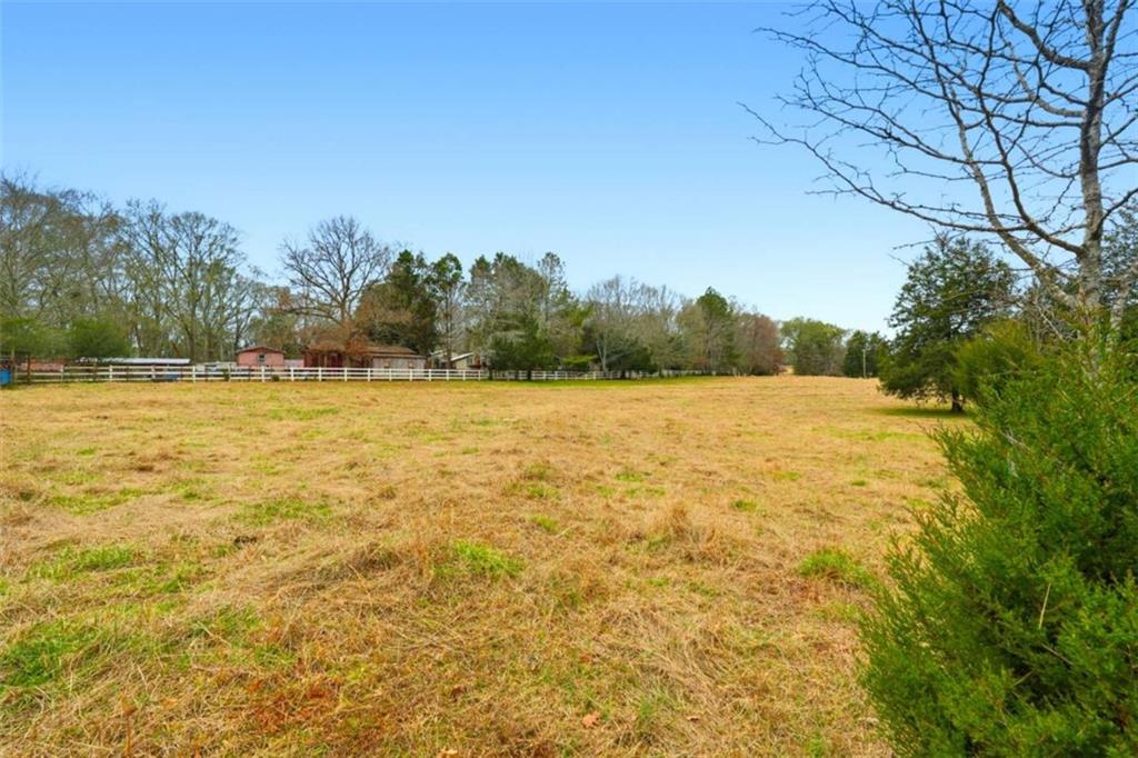 1295 Double Bridges Road Winder, GA 30680 - Photo 44 of 59 a view of swimming pool with an outdoor space and seating area