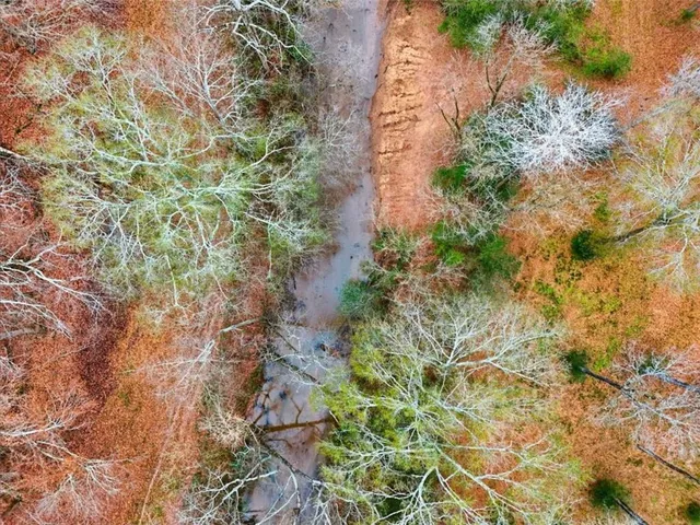 a kitchen with stainless steel appliances granite countertop a stove and white cabinets