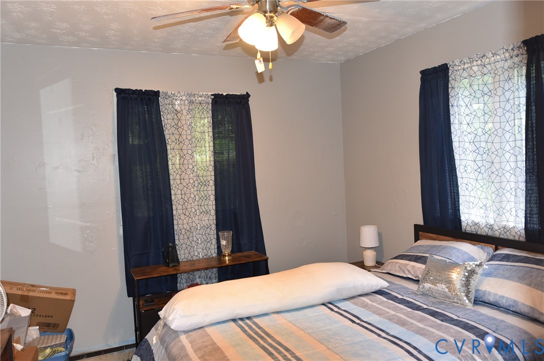 642 Star Street Pounding Mill, VA 24637 - Photo 15 of 20 Bedroom featuring a ceiling fan with integrated li