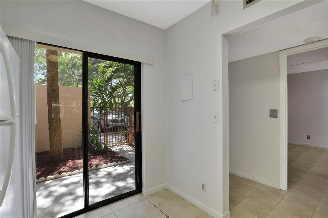 3939 Northeast 5th Avenue, Unit F104 Boca Raton, FL 33431 - Photo 17 of 34 a view of a room that has a bed