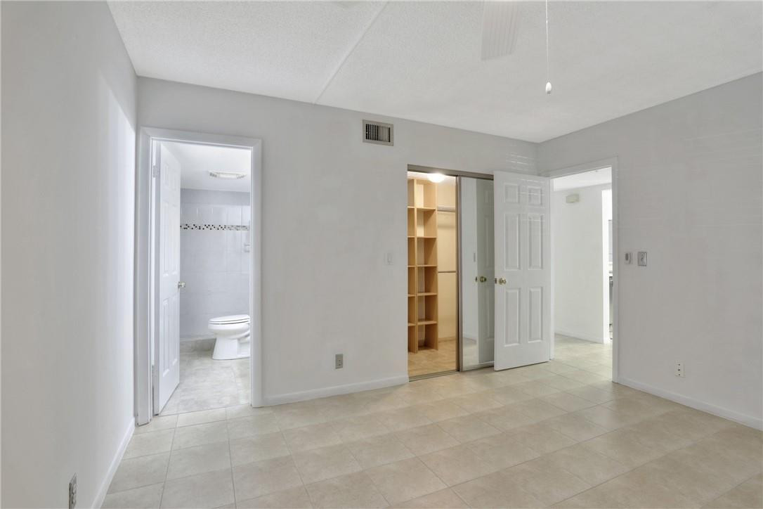 3939 Northeast 5th Avenue, Unit F104 Boca Raton, FL 33431 - Photo 19 of 34 a view of an empty room and a gallery