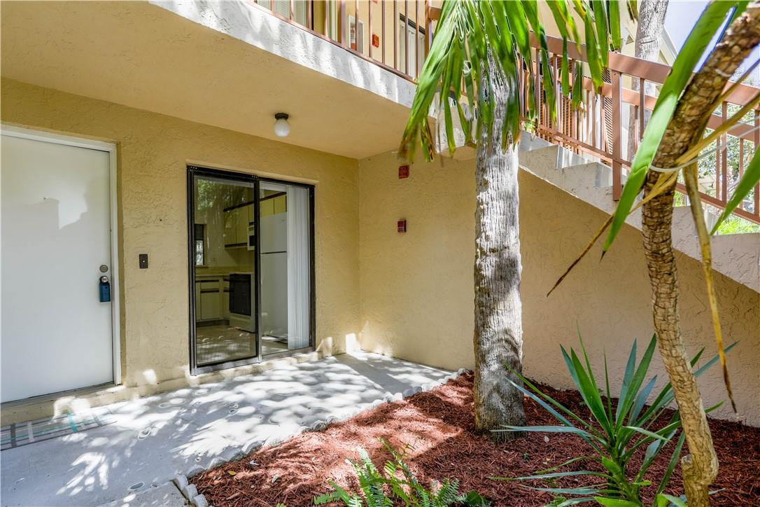 3939 Northeast 5th Avenue, Unit F104 Boca Raton, FL 33431 - Photo 2 of 34 a view of a house with a tree
