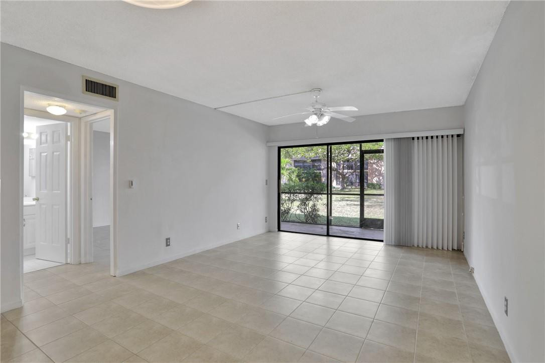 3939 Northeast 5th Avenue, Unit F104 Boca Raton, FL 33431 - Photo 23 of 34 a view of an empty room with a window