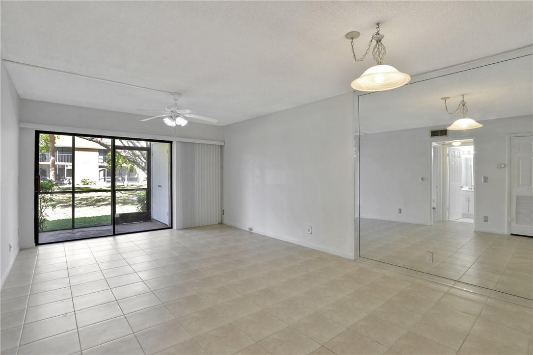 3939 Northeast 5th Avenue, Unit F104 Boca Raton, FL 33431 - Photo 24 of 34 a view of an empty room with a window