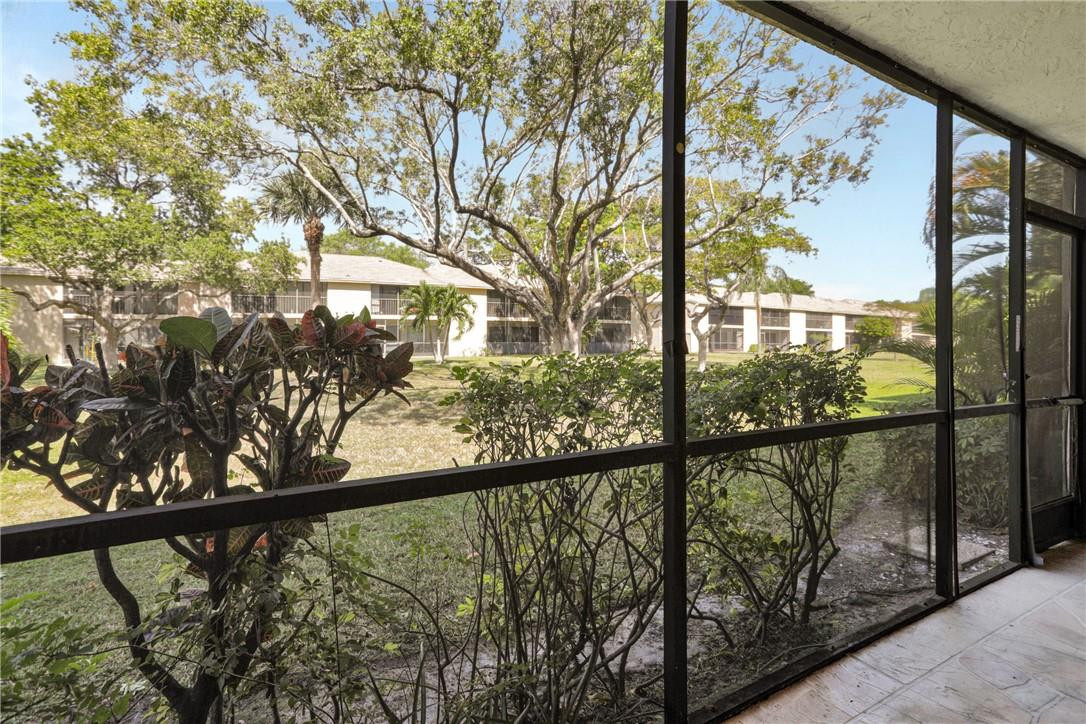 3939 Northeast 5th Avenue, Unit F104 Boca Raton, FL 33431 - Photo 29 of 34 a view of with green trees