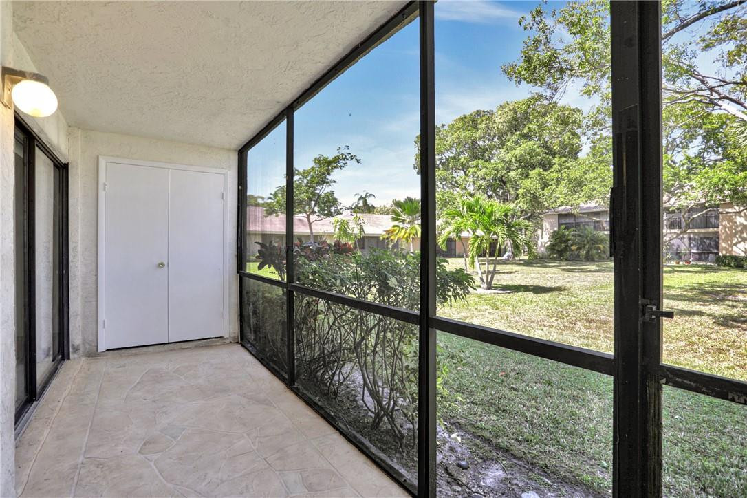 3939 Northeast 5th Avenue, Unit F104 Boca Raton, FL 33431 - Photo 30 of 34 a view of a porch