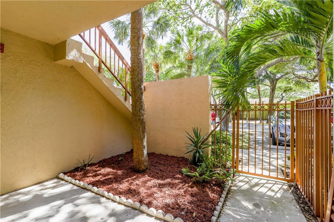 3939 Northeast 5th Avenue, Unit F104 Boca Raton, FL 33431 - Photo 3 of 34 a view of a backyard
