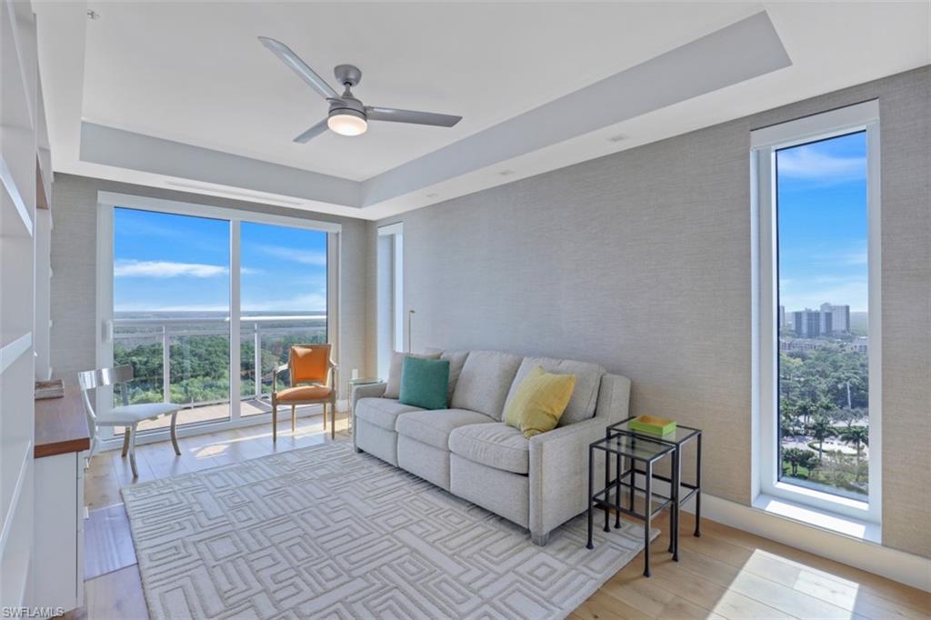 13915 Old Coast Road, Unit 1601 Naples, FL 34110 - Photo 11 of 37 a living room with furniture and a window