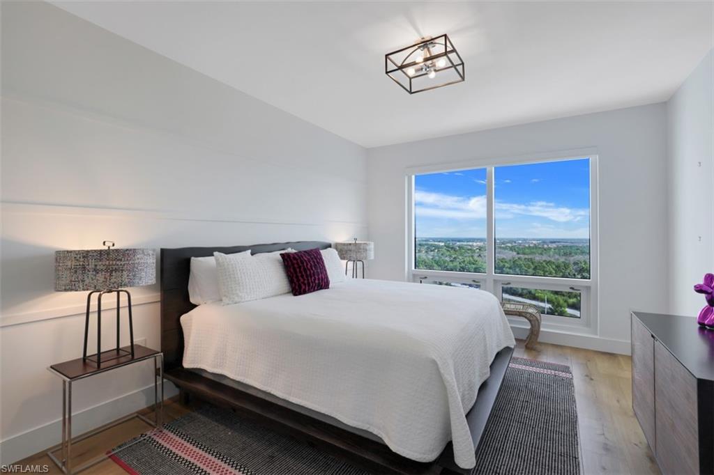 13915 Old Coast Road, Unit 1601 Naples, FL 34110 - Photo 13 of 37 a bedroom with a bed and window