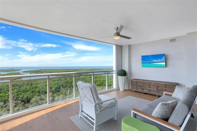 a spacious bedroom with a bed and a view of cabinet