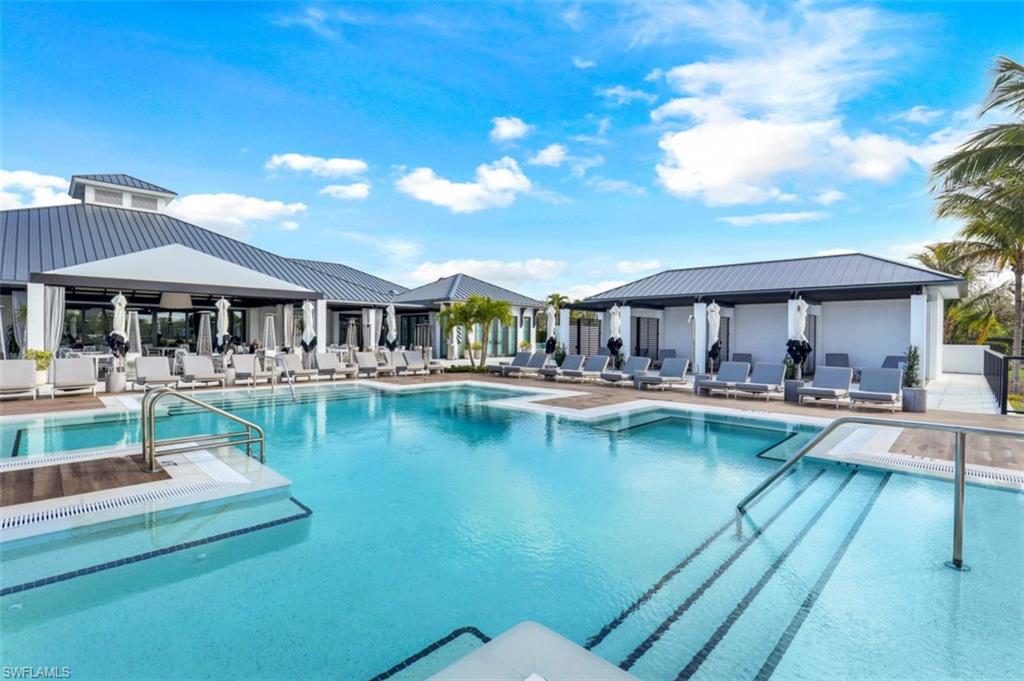 13915 Old Coast Road, Unit 1601 Naples, FL 34110 - Photo 25 of 37 a view of a swimming pool with outdoor seating