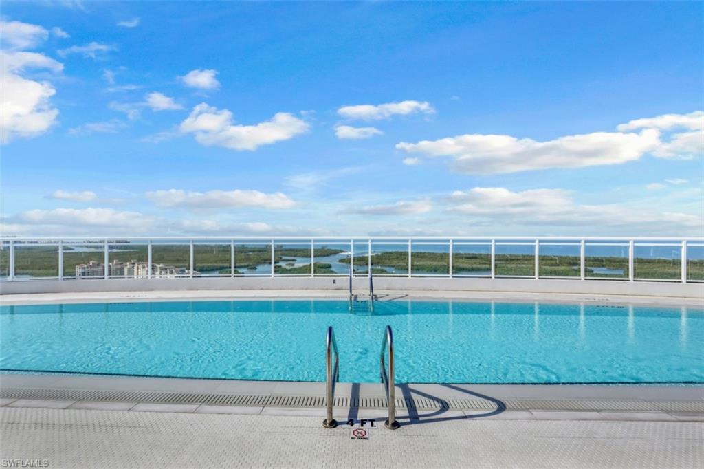 13915 Old Coast Road, Unit 1601 Naples, FL 34110 - Photo 31 of 37 a view of a house next to a yard