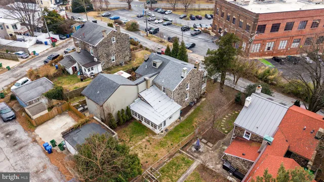 a aerial view of residential houses with outdoor space
