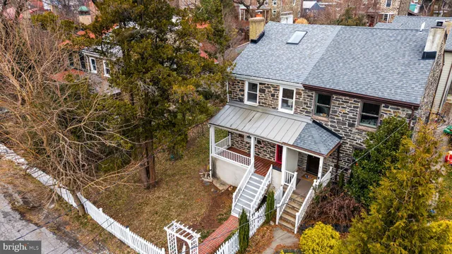 a picture of a bench in front of a wall