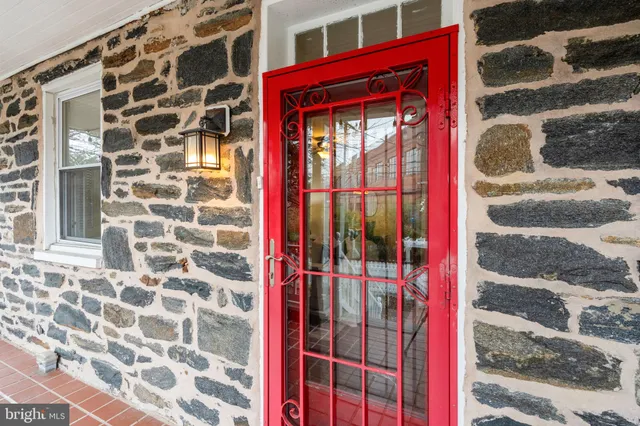 a view of a building with a door and a window